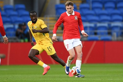 020626 - Wales v Ghana - International Friendly - David Brooks of Wales is challenged by Elisha Owusu of Ghana