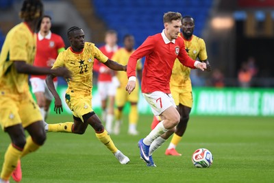 020626 - Wales v Ghana - International Friendly - David Brooks of Wales is challenged by Kamaldeen Sulemana of Ghana