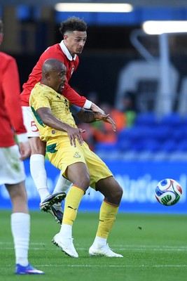 020626 - Wales v Ghana - International Friendly - Ethan Ampadu of Wales is challenged by Jordan Ayew of Ghana