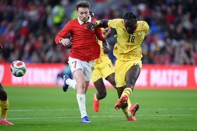 020626 - Wales v Ghana - International Friendly - David Brooks of Wales is challenged by Jerome Opoku of Ghana
