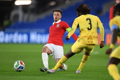 020626 - Wales v Ghana - International Friendly - Ethan Ampadu of Wales is challenged by Caleb Yirenkyi of Ghana