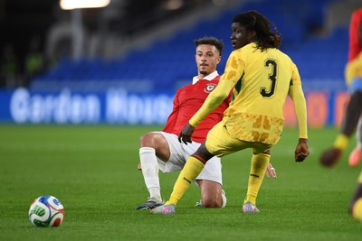 020626 - Wales v Ghana - International Friendly - Ethan Ampadu of Wales is challenged by Caleb Yirenkyi of Ghana
