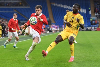 020626 - Wales v Ghana - International Friendly - Neco Williams of Wales is challenged by Gideon Mensah of Ghana