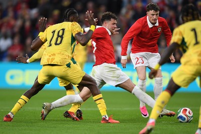 020626 - Wales v Ghana - International Friendly - Neco Williams of Wales is challenged by Jerome Opoku of Ghana