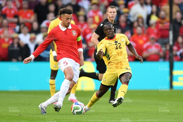 020626 - Wales v Ghana - International Friendly - Ethan Ampadu of Wales is challenged by Kamaldeen Sulemana of Ghana