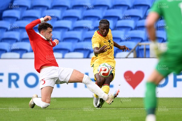 020626 - Wales v Ghana - International Friendly - Kamaldeen Sulemana of Ghana has his shot blocked by Neco Williams of Wales