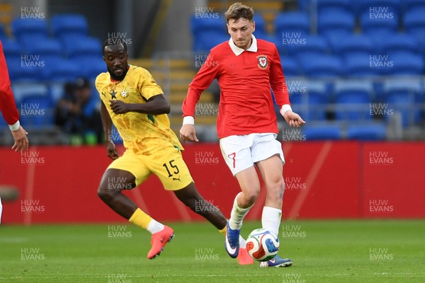 020626 - Wales v Ghana - International Friendly - David Brooks of Wales is challenged by Elisha Owusu of Ghana