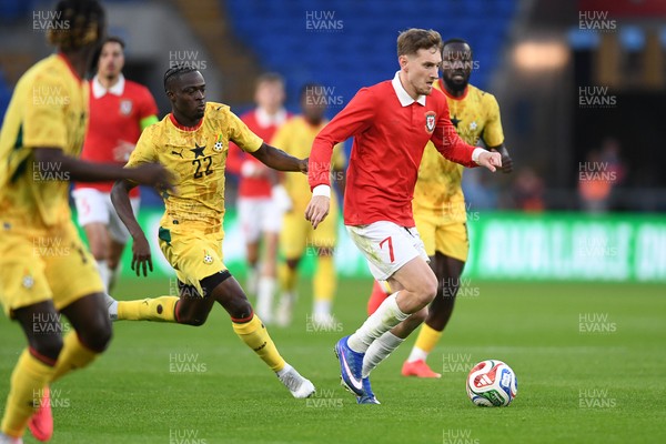 020626 - Wales v Ghana - International Friendly - David Brooks of Wales is challenged by Kamaldeen Sulemana of Ghana