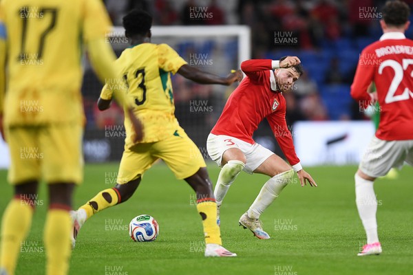 020626 - Wales v Ghana - International Friendly - Neco Williams of Wales is challenged by Christopher Bonsu Baah of Ghana