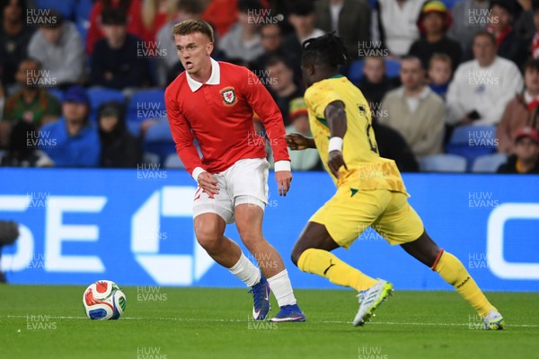 020626 - Wales v Ghana - International Friendly - Isaak Davies of Wales is challenged by Alidu Seidu of Ghana