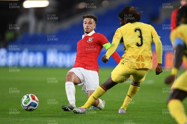 020626 - Wales v Ghana - International Friendly - Ethan Ampadu of Wales is challenged by Caleb Yirenkyi of Ghana