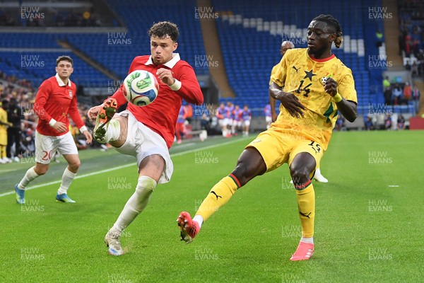 020626 - Wales v Ghana - International Friendly - Neco Williams of Wales is challenged by Gideon Mensah of Ghana