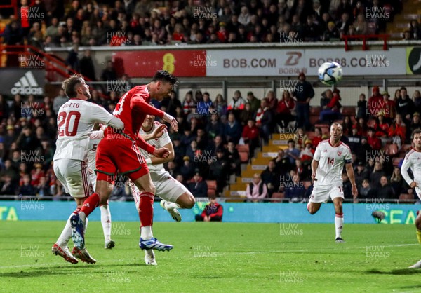 111023 - Wales v Gibraltar - International Challenge Match - Kieffer Moore of Wales heads home to score the fourth goal