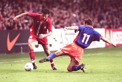 051096 - Wales v Holland - Marcus Browning of Wales gets past Philip Cocu
