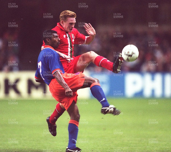 051096 - Wales v Holland - Mark Pembridge of Wales challenges Aron Winter