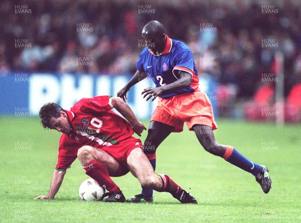 051096 - Wales v Holland - Mark Hughes of Wales is tackled by Ferdi Vierklau
