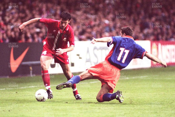 051096 - Wales v Holland - Marcus Browning of Wales gets past Philip Cocu