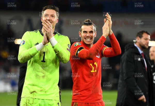 191119 - Wales v Hungary - UEFA Euro Championship Qualifying - Wayne Hennessey and Gareth Bale of Wales celebrate at the end of the game