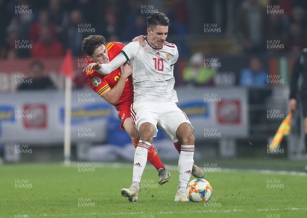 191119 - Wales v Hungary, European Cup 2020 Qualifier - Daniel James of Wales tangles with Dominik Szoboszlai of Hungary as they compete for the ball
