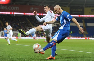 050314 - Wales v Iceland - Friendly -Gareth Bale of Wales challenges Emil Hallfredsson of Iceland