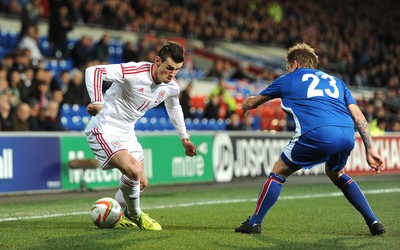 050314 - Wales v Iceland - Friendly -Gareth Bale of Wales is challenged by Ari Skulason of Iceland