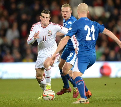050314 - Wales v Iceland - Friendly -Gareth Bale of Wales and Emil Hallfredsson of Iceland compete