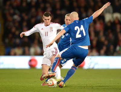 050314 - Wales v Iceland - Friendly -Gareth Bale of Wales and Emil Hallfredsson of Iceland compete