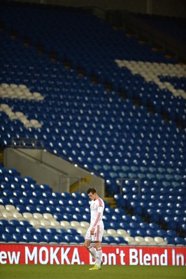 050314 - Wales v Iceland - Friendly -Gareth Bale of Wales looks on in front of rows of empty seats