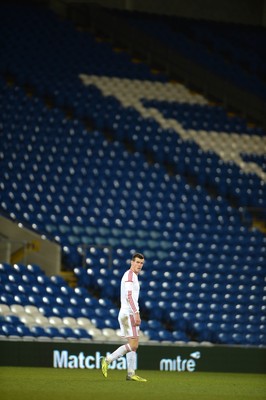 050314 - Wales v Iceland - Friendly -Gareth Bale of Wales looks on in front of rows of empty seats
