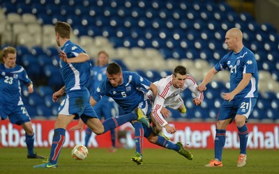 050314 - Wales v Iceland - Friendly -Gareth Bale of Wales collides with Solvi Geir Ottesen Jonsson of Iceland
