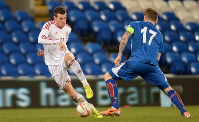 050314 - Wales v Iceland - Friendly -Gareth Bale of Wales tries to get past Aron Gunnarsson of Iceland