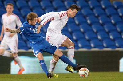 050314 - Wales v Iceland - Friendly -Gareth Bale of Wales is tackled by Ari Skulason of Iceland
