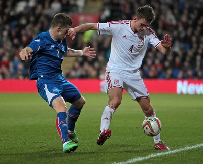 050314 - Wales v Iceland - Vauxhall International Friendly - Emyr Huws of Wales is tackled by Johann Berg Gudmundsson of Iceland 