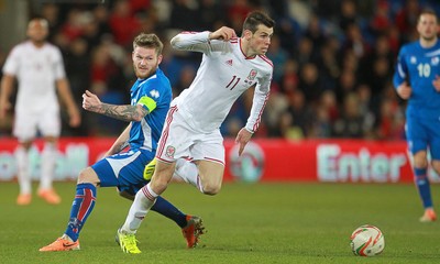 050314 - Wales v Iceland - Vauxhall International Friendly - Gareth Bale of Wales gets past Aron Einar Gunnarsson of Iceland 