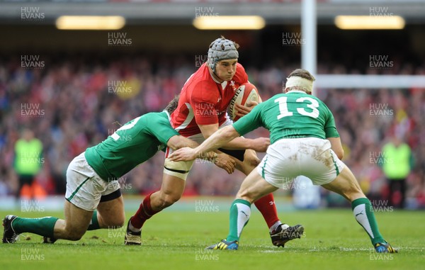 020213 - Wales v Ireland - RBS Six Nations -Jonathan Davies of Wales takes on Gordon D'Arcy and Brian O'Driscoll of Ireland