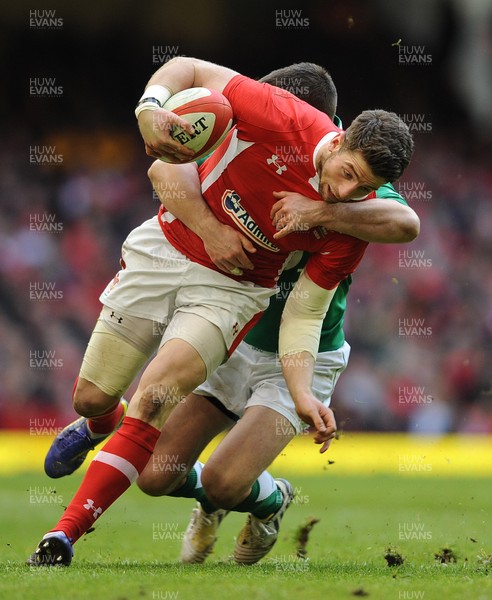 020213 - Wales v Ireland - RBS Six Nations -Alex Cuthbert of Wales is tackled by Jonathan Sexton of Ireland