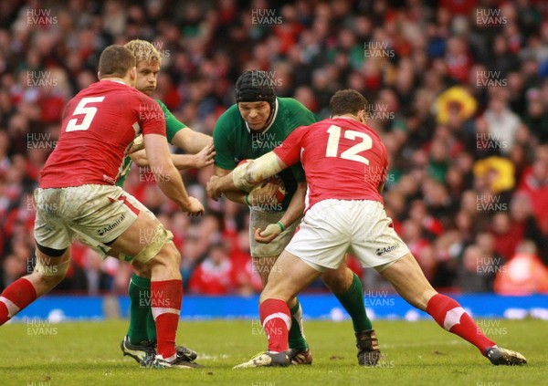 020213 Wales v Ireland - RBS 6 Nations -Ireland's Mike Ross is tackled by Wales' Jamie Roberts