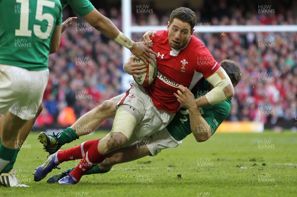 020213 - Wales v Ireland, 2013 RBS 6 Nations - Wales' Alex Cuthbert is tackled by Ireland's Brian O'Driscoll