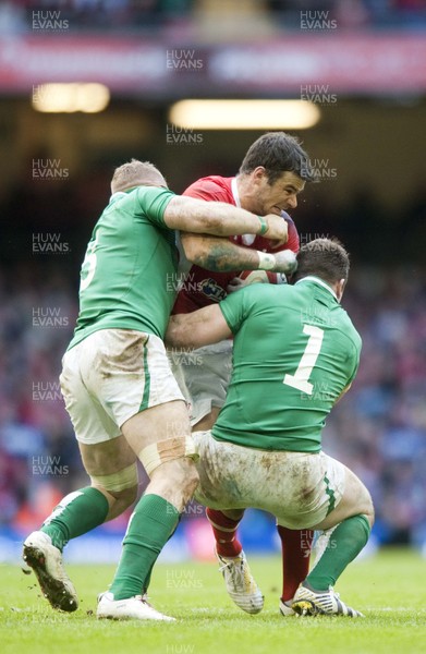 020213 -  Wales v Ireland - RBS 6Nations - Wales' Mike Phillips is tackled by Ireland's Donnacha Ryan, left, and Cian Healy