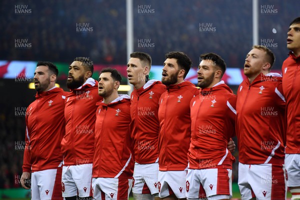 040223 - Wales v Ireland - Guinness Six Nations - Scott Baldwin, Taulupe Faletau, Tomos Williams, Liam Williams, Owen Williams, Rhys Webb and Tommy Reffell during the anthems