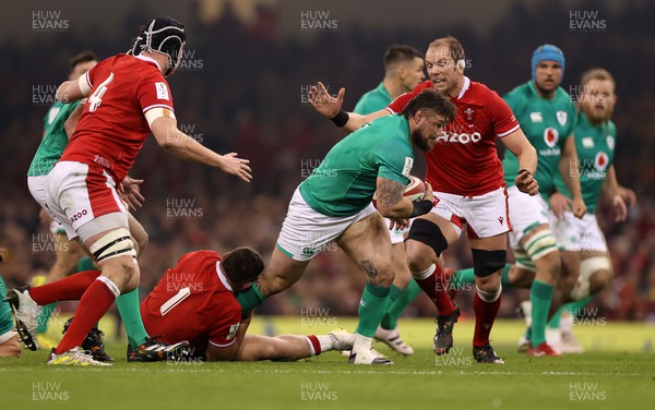 040223 - Wales v Ireland - Guinness Six Nations Championship - Andrew Porter of Ireland is tackled by Gareth Thomas and Alun Wyn Jones of Wales 