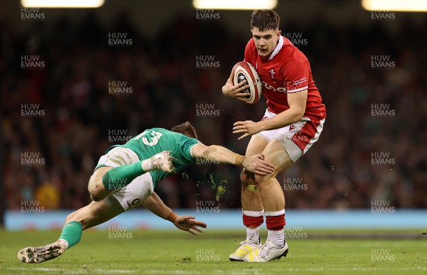 040223 - Wales v Ireland - Guinness Six Nations Championship - Joe Hawkins of Wales is challenged by Garry Ringrose of Ireland 