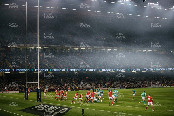 040223 - Wales v Ireland - Guinness Six Nations Championship - Smoke fills the stadium during play