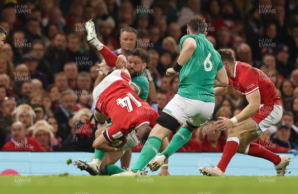 040223 - Wales v Ireland, Guinness Six Nations 2023 - Josh Adams of Wales is tackled by Andrew Porter of Ireland
