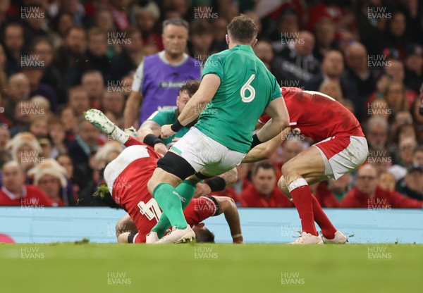 040223 - Wales v Ireland, Guinness Six Nations 2023 - Josh Adams of Wales is tackled by Andrew Porter of Ireland
