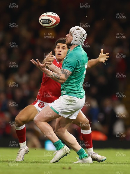 040223 - Wales v Ireland, Guinness Six Nations 2023 - Mack Hansen of Ireland claims the ball as Rio Dyer of Wales closes in