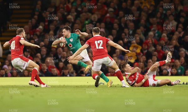 040223 - Wales v Ireland, Guinness Six Nations 2023 - Hugo Keenan of Ireland takes on Joe Hawkins of Wales