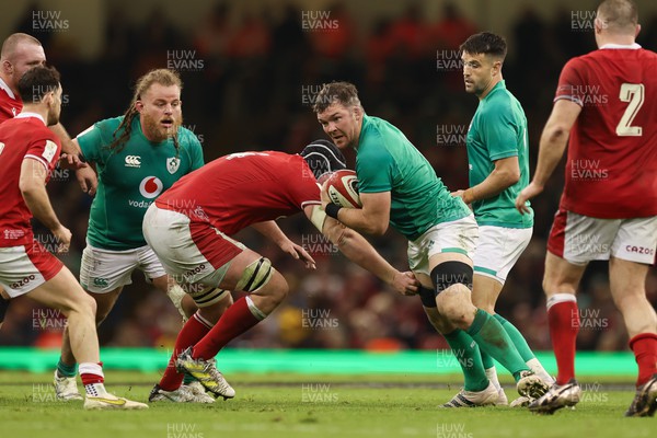 040223 - Wales v Ireland, Guinness Six Nations 2023 - Peter O’Mahony of Ireland is tackled by Adam Beard of Wales