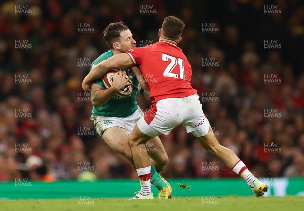 040223 - Wales v Ireland, Guinness Six Nations 2023 - Hugo Keenan of Ireland is tackled by Rhys Webb of Wales