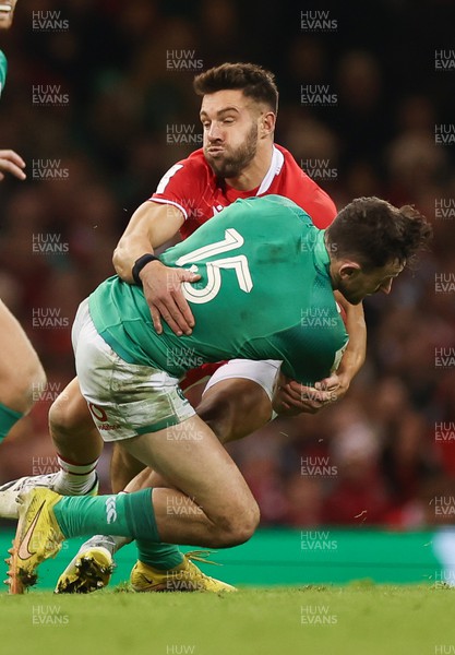 040223 - Wales v Ireland, Guinness Six Nations 2023 - Hugo Keenan of Ireland is tackled by Rhys Webb of Wales